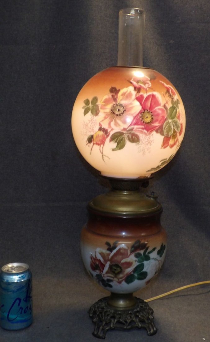 ANTIQUE "SUCCESS" GONE WITH THE WIND LAMP: Antique "Success" Gone with the Wind Lamp. Measures 25" x 9". Condition is good. Small chip on bottom of top globe (see close-up photo). Starting Bid $20. Auction Estimate $60 - $80.