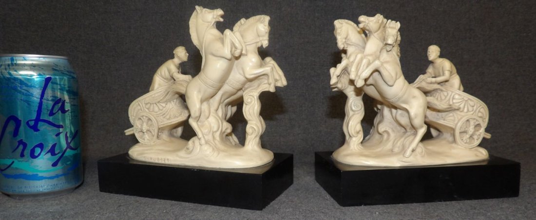 G. RUGGERI BEN-HUR CHARIOT BOOKENDS: Greek Roman Ben-Hur Chariot Figure Bookends. Signed "G. Ruggeri". Each measure 6-1/2" tall x 6-1/2" wide x 3-1/2" deep. Condition is very good. No damage. Starting Bid $10. Auction Estimate $120 - $20