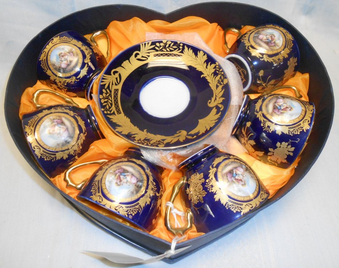 6 Cups & Saucers by Luigi & Sons: Highly Decorated set of 6 Cups & Saucers by Luigi & Sons. Includes Decorative Fitted Gift Box. Saucers are 5-1/2". Cups sand 2-5/8" tall. Condition of entire set is mint. No damage.