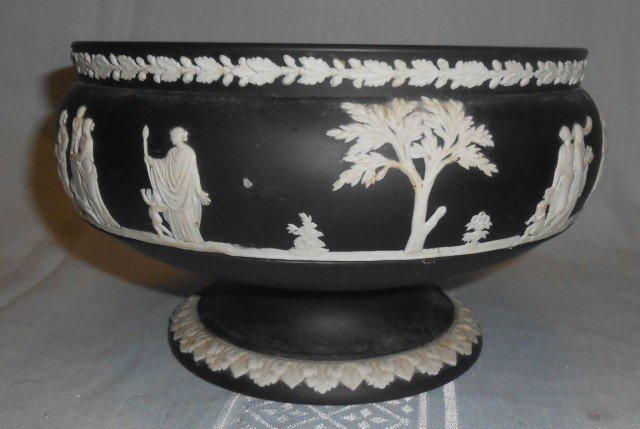 Wedgwood Black Basalt Jasperware Bowl: Wedgwood Black Basalt Jasperware Bowl. Measures 9" round x 5" tall. Condition is good with typical surface scratches from age. No Damage. Starting bid $100.
