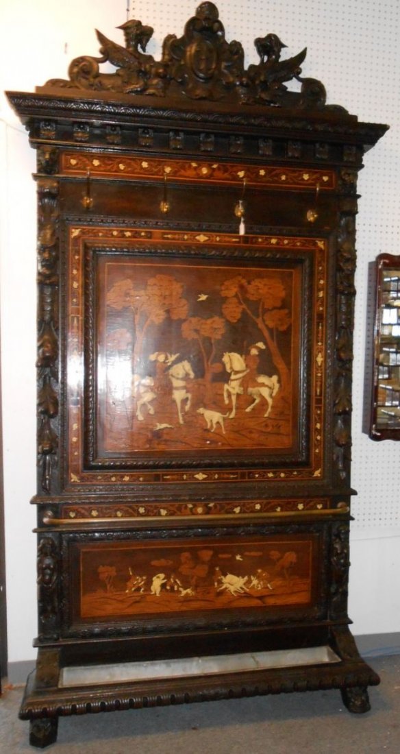Spectacular Antique Inlaid Hall Stand: Magnificent Antique Inlaid Hall Stand from Milano, Italy. Carved Walnut with inlays of Bone. Circa 1880's. Absolutely Beautiful. Inlay scenes of hunting. A Must see. Stands 105" tall x 54" wide. Condi