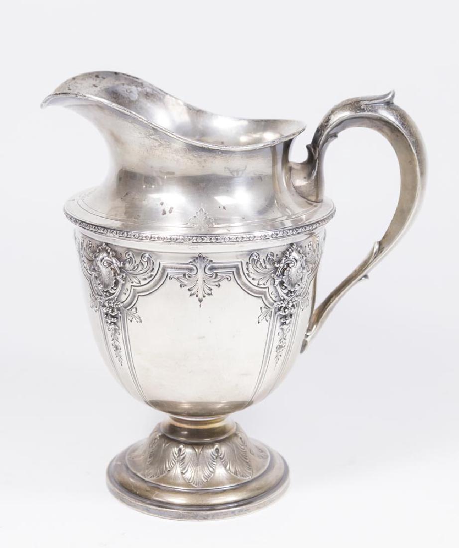 Sterling Silver Pitcher: Approx. 9 1/2" H. Approx. 20.48 ozt. Property from a Manhattan townhouse. Dents.
