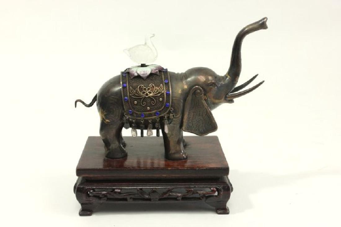 :Elephant with Rock Crystal Bird: Stamped silver on tusk. Adorned with semiprecious stones. Without stand approx. 4 1/4" x 5 1/2".
