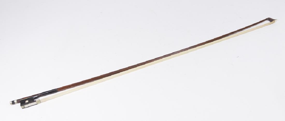 Nickel & Mother of Pearl Violin Bow: Octagon stick, indistinguishable mark over frog, mother of pearl & ebony Frog, 4/4 size. (100) Missing mother of pearl Parisian eye.