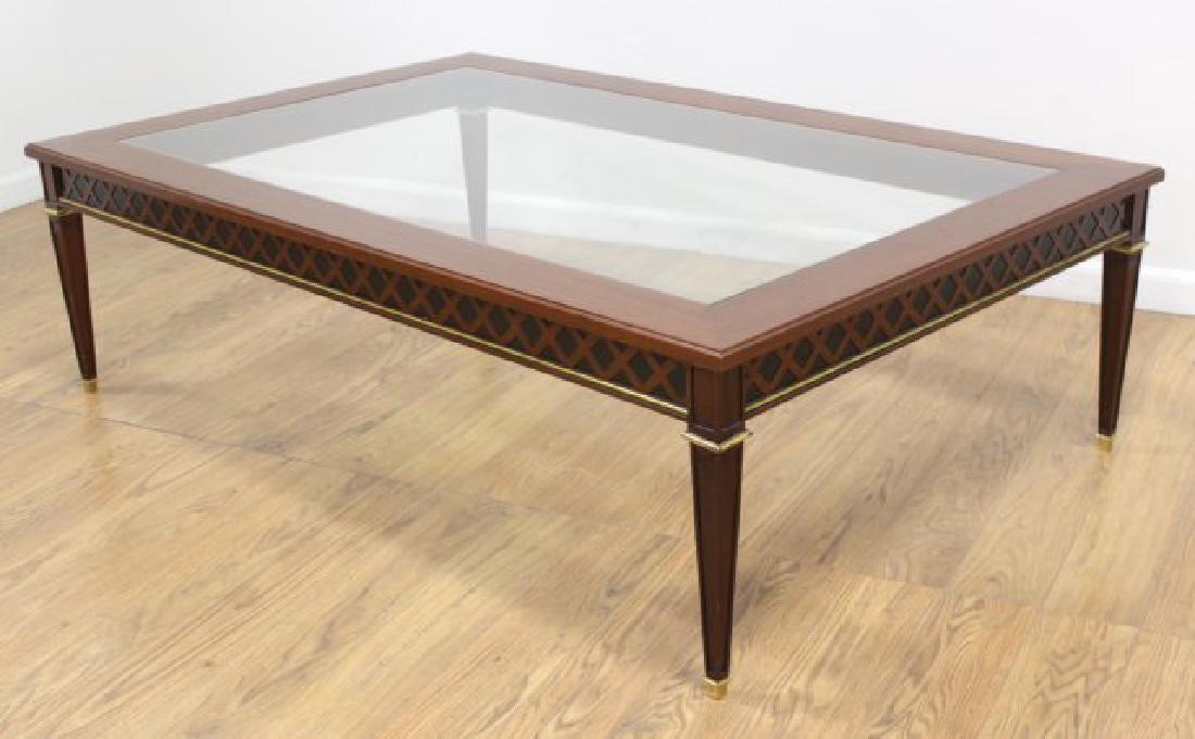 Neoclassic Style Mahogany Coffee Table: Brass mounted. Approx. 17 1/2" H x 38 1/2" W x 60" L.