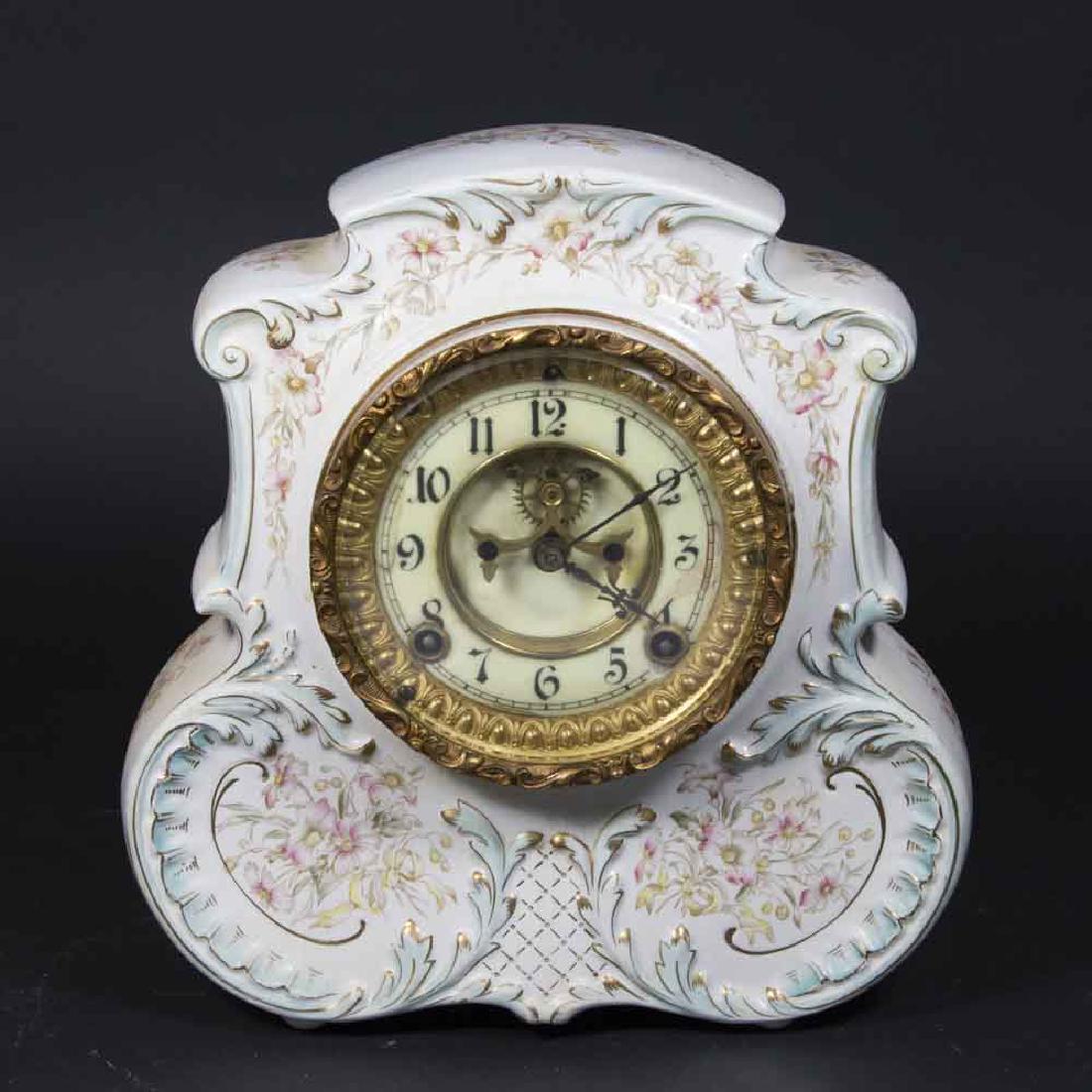Royal Bonn Porcelain Unmarked Case Ansonia Clock: Open escapement. Approx. 10 1/2" H x 10" W. (6055) Some lines in porcelain and dial.