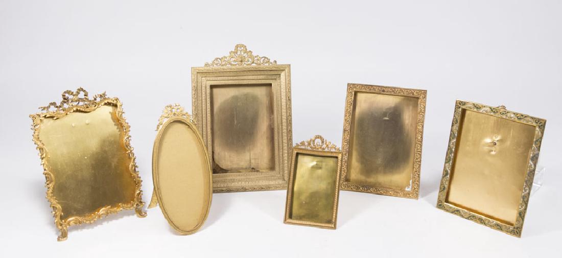 6 Continental Gilt Metal Frames: 1 oval, 5 rectangular. 1 enamelled. Largest approx. 9" H. From an Edgewater, NJ estate. Some dents.