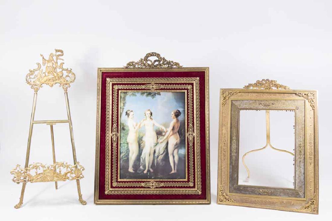 2 Larger Continental Gilt Metal Frames & Easel: Easel approx. 21 1/2" H. From an Edgewater, NJ estate. 1 dented inner frame.