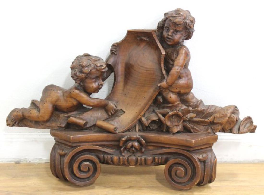 Carved Walnut Figural Mantel Top: Approx. 17 1/2" x 25 1/2".