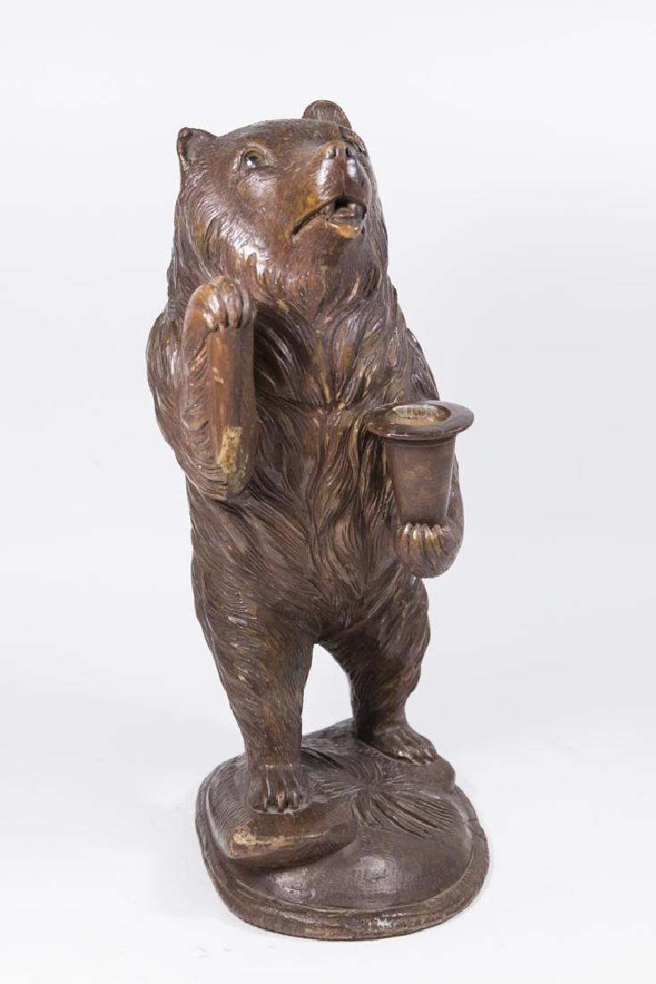 Black Forest Carved Bear: Glass eyes. Approx. 15 1/2" H. Damage to base. Staff broken.