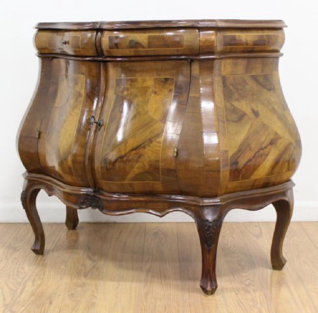 Italian Walnut Ribbon-Front Commode: 2 doors that belly out. Banded top. Approx. 32" H x 34" W x 16 1/2" D.