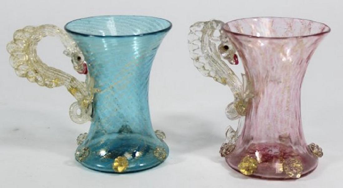 2 Venetian Gilt Colored Glass Dragon Mugs: Late 19th/early 20th century. Attributed to Salviati & C. Artisti Barovier or Fratelli Toso. Approx. 4 1/4" H. From a NY estate. (6092) Good condition.