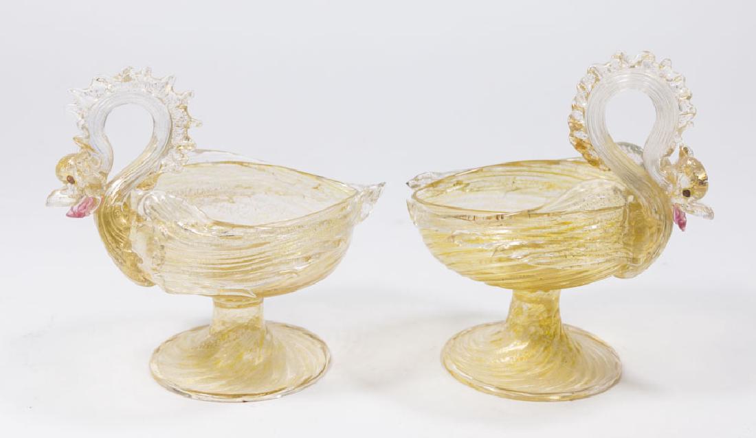 Pair Venetian Gilt Clear Glass Griffon Sauce Boats: Late 19th/early 20th century. Attributed to Salviati & C. Artisti Barovier or Fratelli Toso. Approx. 5 1/2" H. From a NY estate. (6092) Good condition.