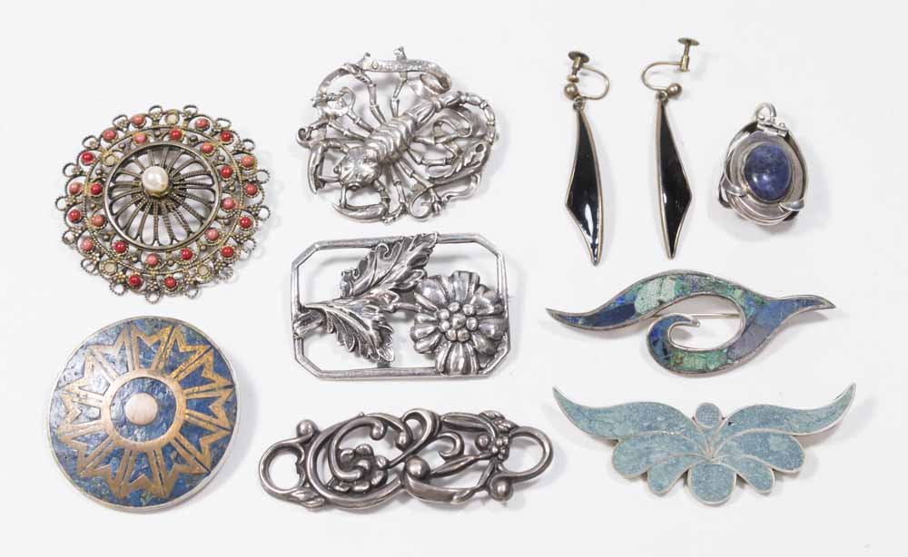 Tray Lot 925 & Turquoise Jewelry: Including lapis & 925 locket, sterling Cini scorpio, sterling floral pin, 925 & coral pin, pair sterling silver earrings, 925 "om." 8 pieces total.