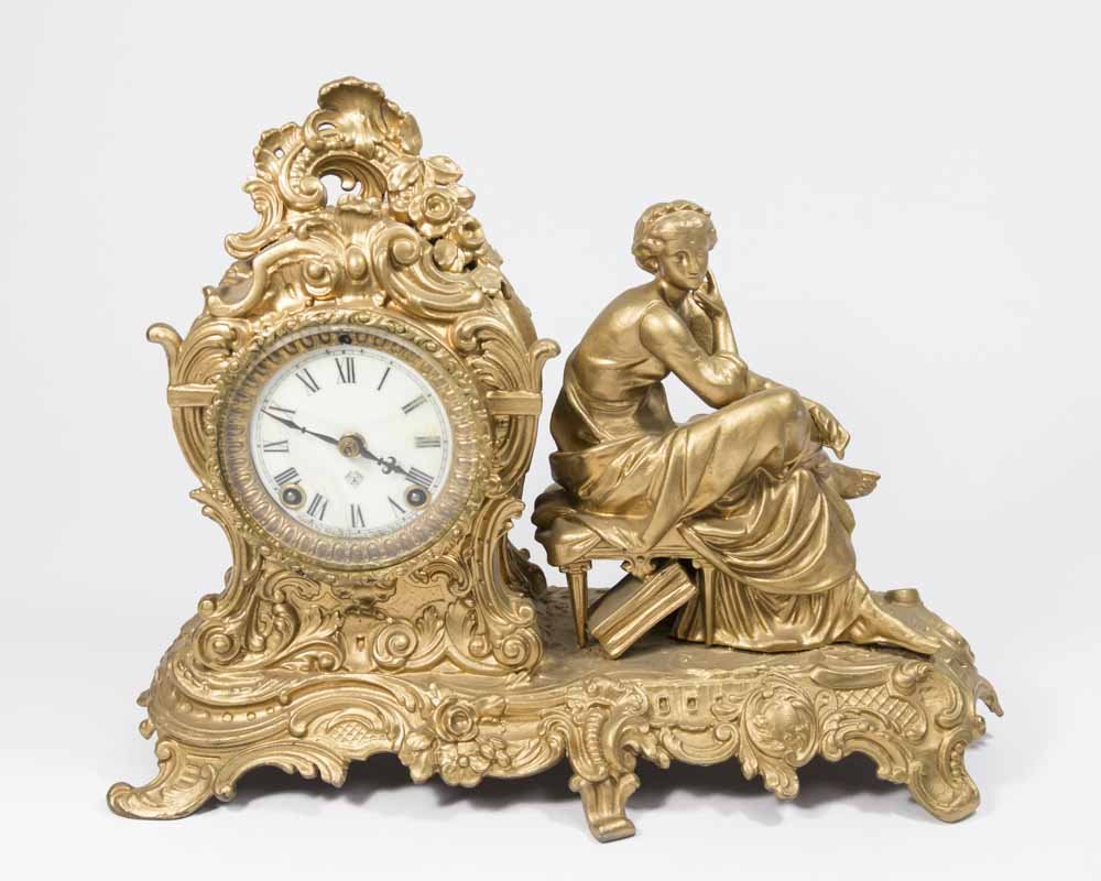 Figural Ansonisa Clock: Approx. 11" H x 14" W.