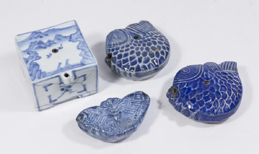 4 Korean Blue Glaze Water Droppers: Largest approx. 1 3/4" H x 2 1/2" W. One smaller with damage to glaze near hole. Larger one with hairline cracks throughout.