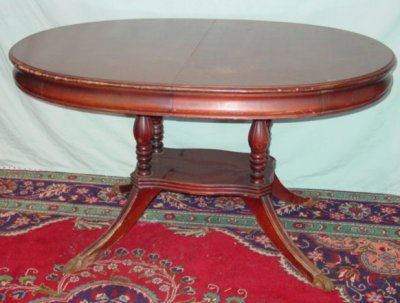 MAHOGANY OVAL PEDESTAL TABLE: FURNITURE.MAHOGANY OVAL PEDESTAL TABLE WITH LEAF. TOP IS FORMICA CA. 1940'S (NEEDS REFINISHING)
