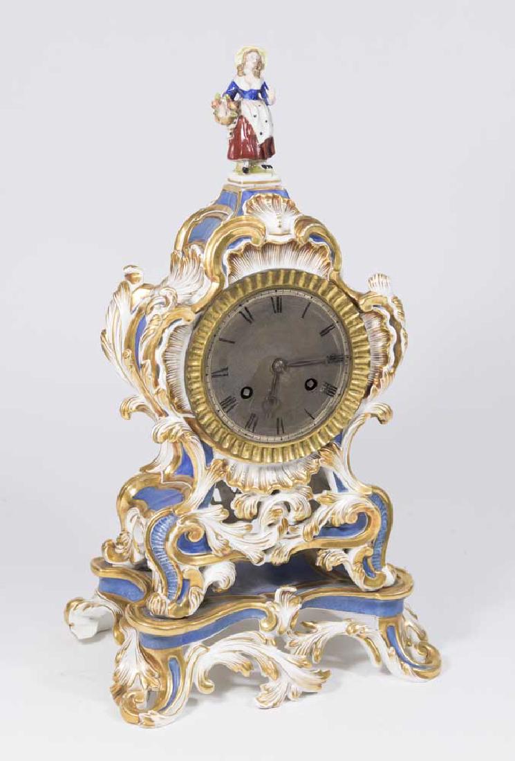 Porcelain Figural Clock: Pendulum and key. Approx. 15 1/2" x 8 1/2".