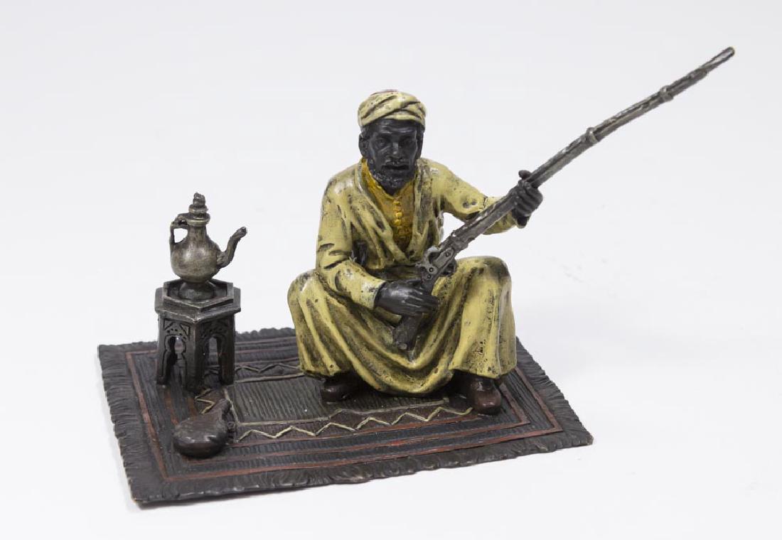 Contemp. Bergman Bronze, Orientalist Man w/ Rifle: Cold-patinated. Approx. 4" x 5". (6158)