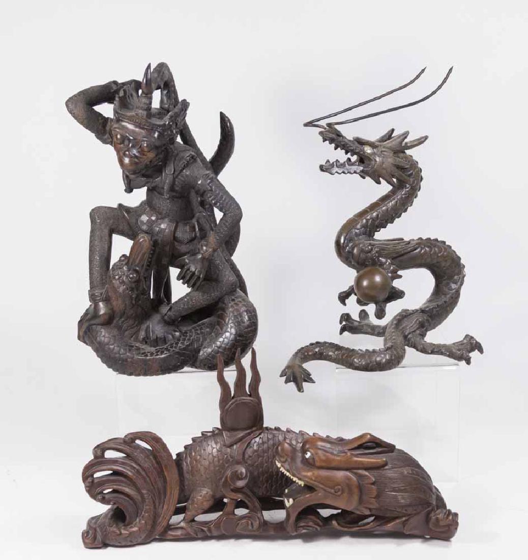 2 Chinese Dragons & Wood Carving of Monkey: 1 carved wood dragon with bone teeth, circa 1920s, approx. 7 3/8" x 13 1/2"; bronze dragon with a ball, early 20th century, approx. 11 3/4" x 8 1/2"; and monkey fighting serpent, approx. 13 1/4" H. Pr