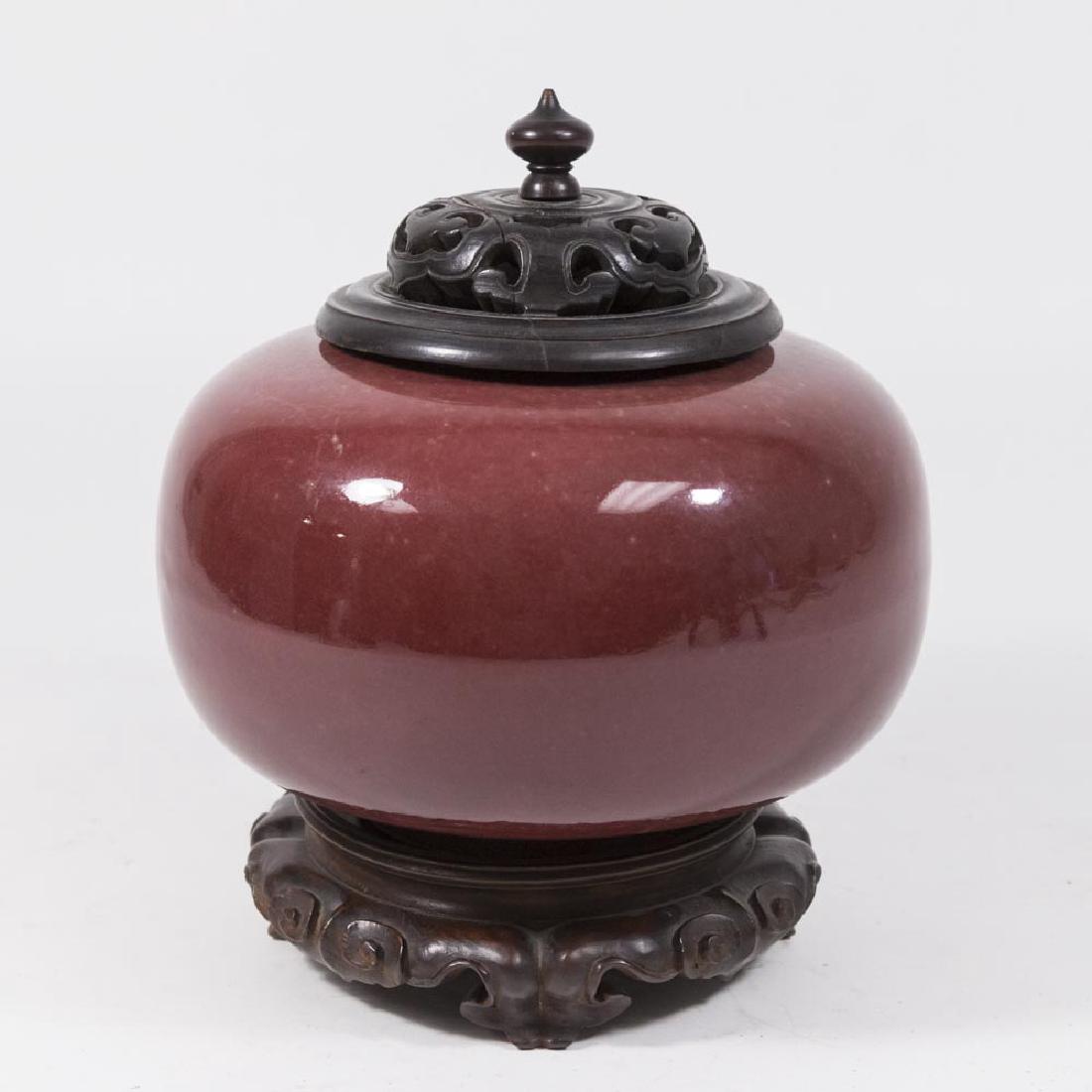 Sang de Boeuf Censer on Wood Base: With wood top. Approx. 6" H without base and lid, 9" H total. Split on wood lid, otherwise good condition.