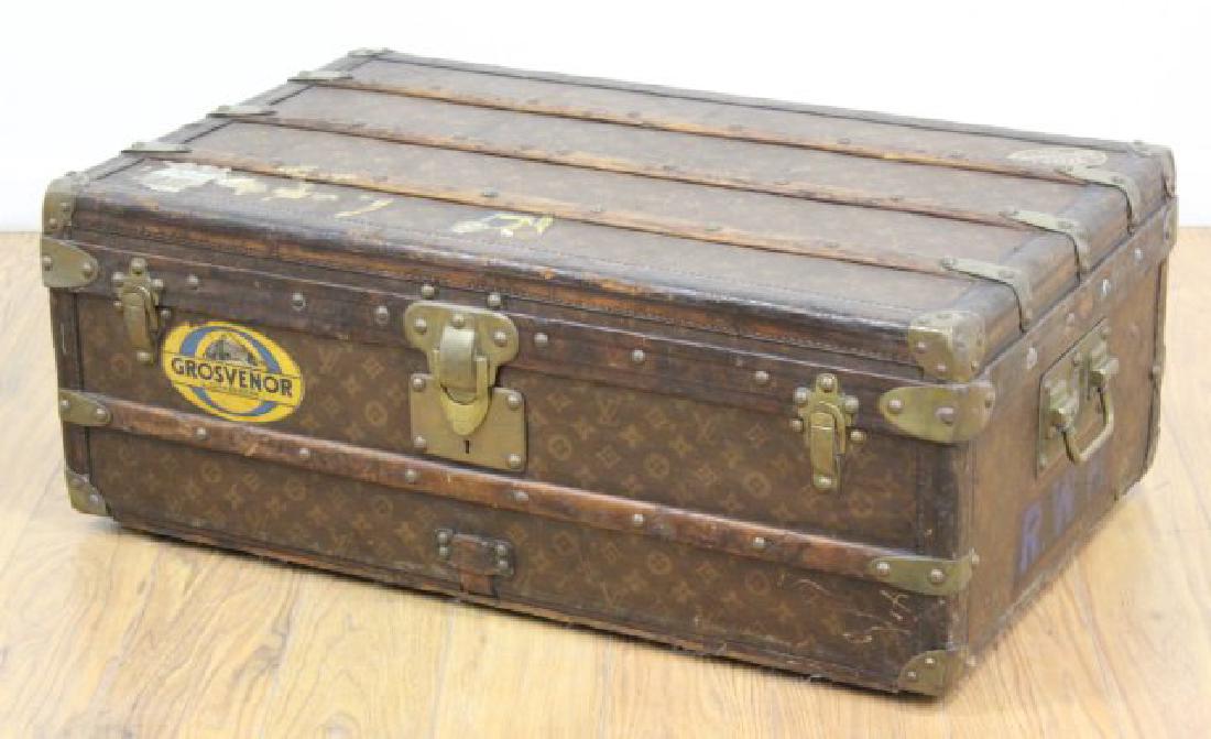 Louis Vuitton Trunk: Wood straps. Old stickers. Approx. 12" H x 31 1/2" W x 19 1/2" D. From the home of a N.Y. designer. Worn finish.