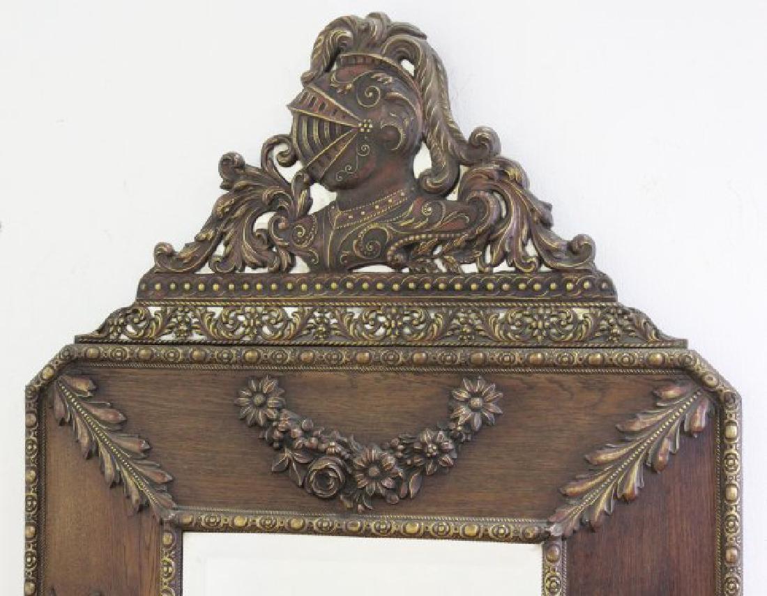 Brass-Clad Mirror with Military Motif: Circa 1920s. Bevelled mirror. Approx. 54" H x 33" W.