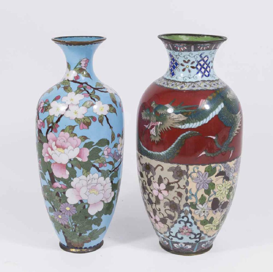 2 Chinese Cloisonné Vases: 1 floral with blue background. 1 dragon and floral design. Both approx. 12" H. From a Manhattan estate. Vase with blue background has damage to inner rim.