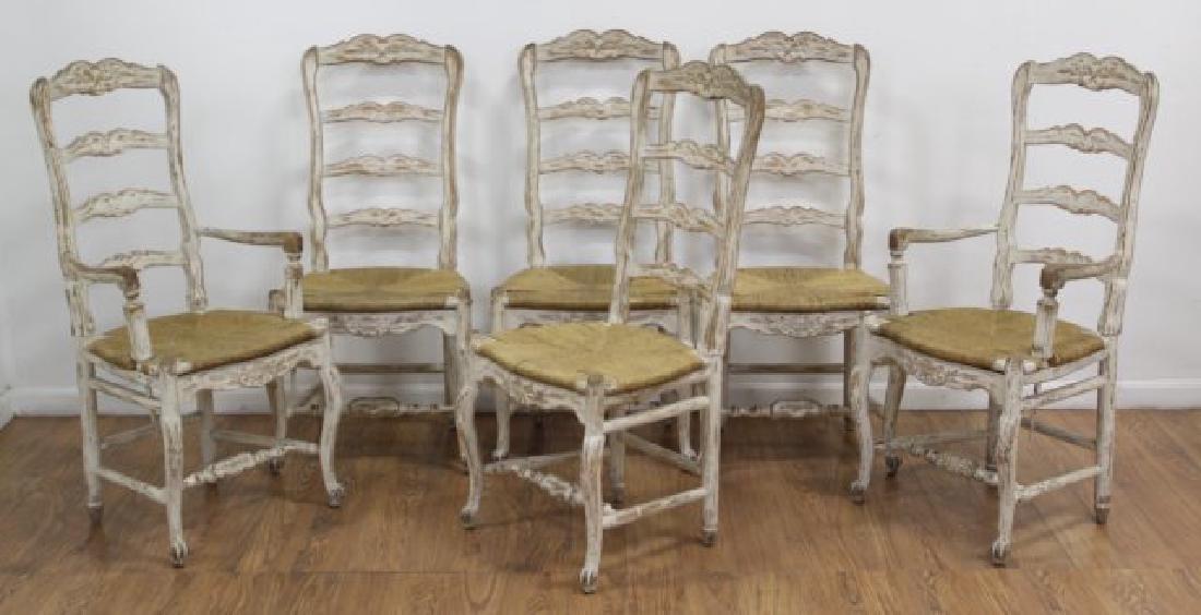 6 Ladder Back Country French Chairs: With rush seats. With rush seats. Approx. 43" H x 17" W x 21 1/2" arm to arm.