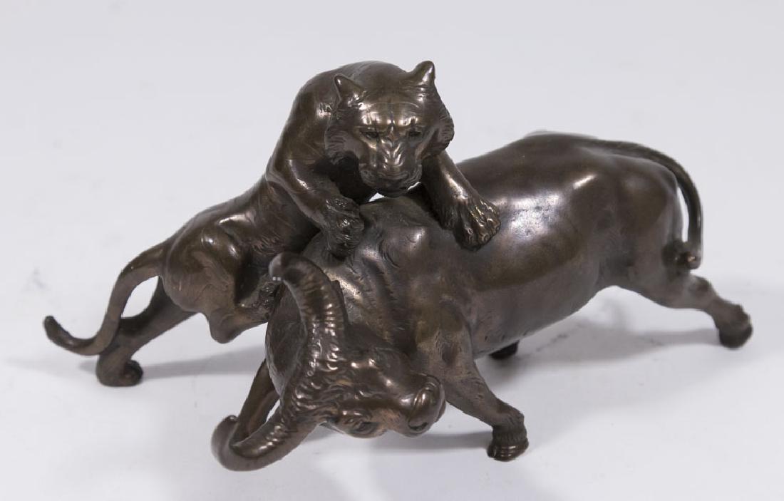 Japanese Bronzed Metal Tiger Attacking Buffalo: Stamped maker's mark. Approx. 4 1/2" H x 7 1/4". (6189)