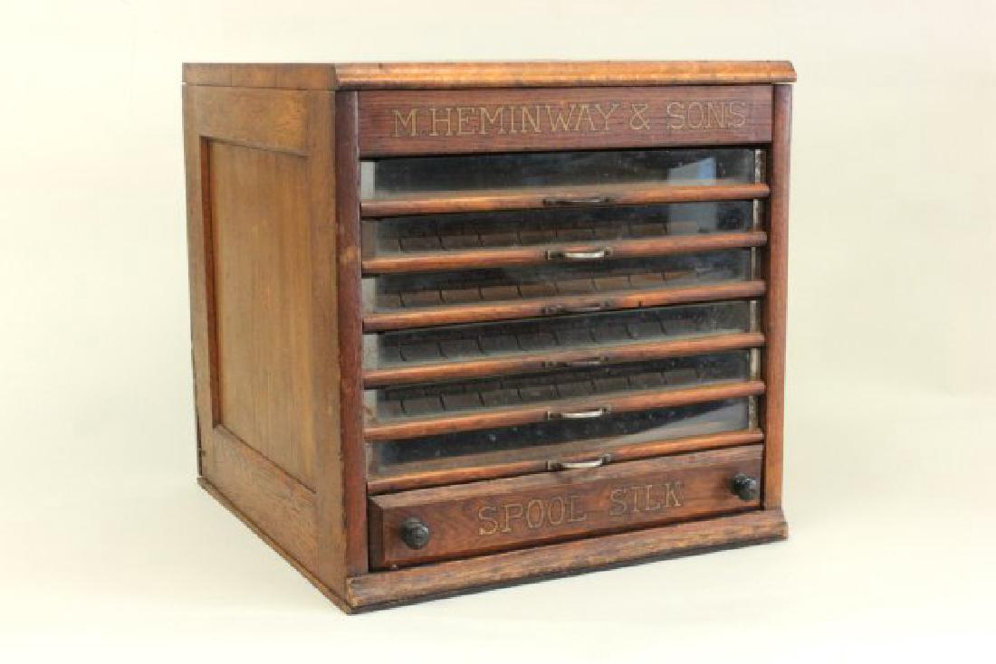 M Heminway & Sons Spool Cabinet: Oak cabinet. Approx. 17 1/4" high by 17" wide, 17" deep. (6183.50)