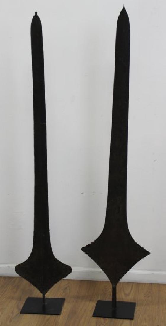 2 African Metal Dowry Currencies: Congo. Approx. 65" H.