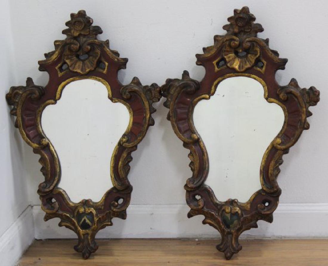 2 Borghese Carved Mirrors: Plaster molded. Red with gold highlights. Approx. 22" H x 14" W.