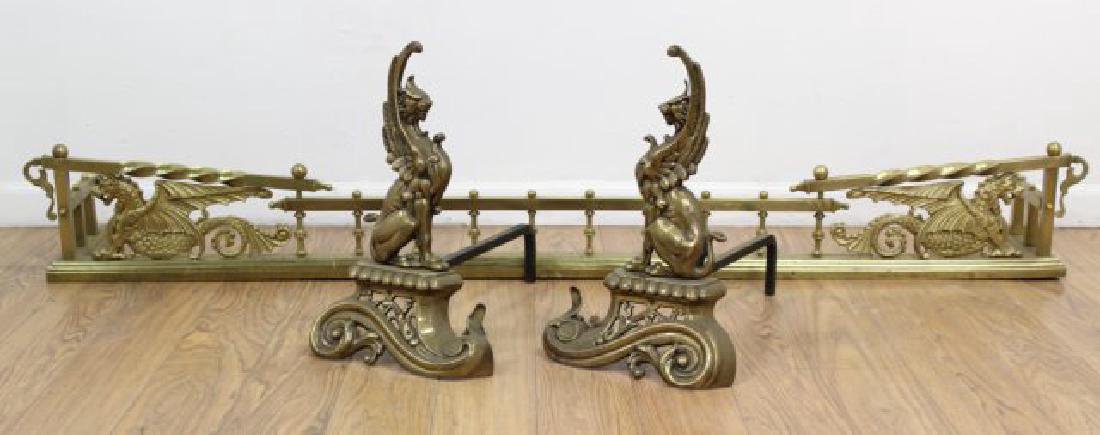 Brass Griffon Form Fender & Andirons: Neoclassic style. Andirons approx. 17" H, fender approx. 67 1/2" W.