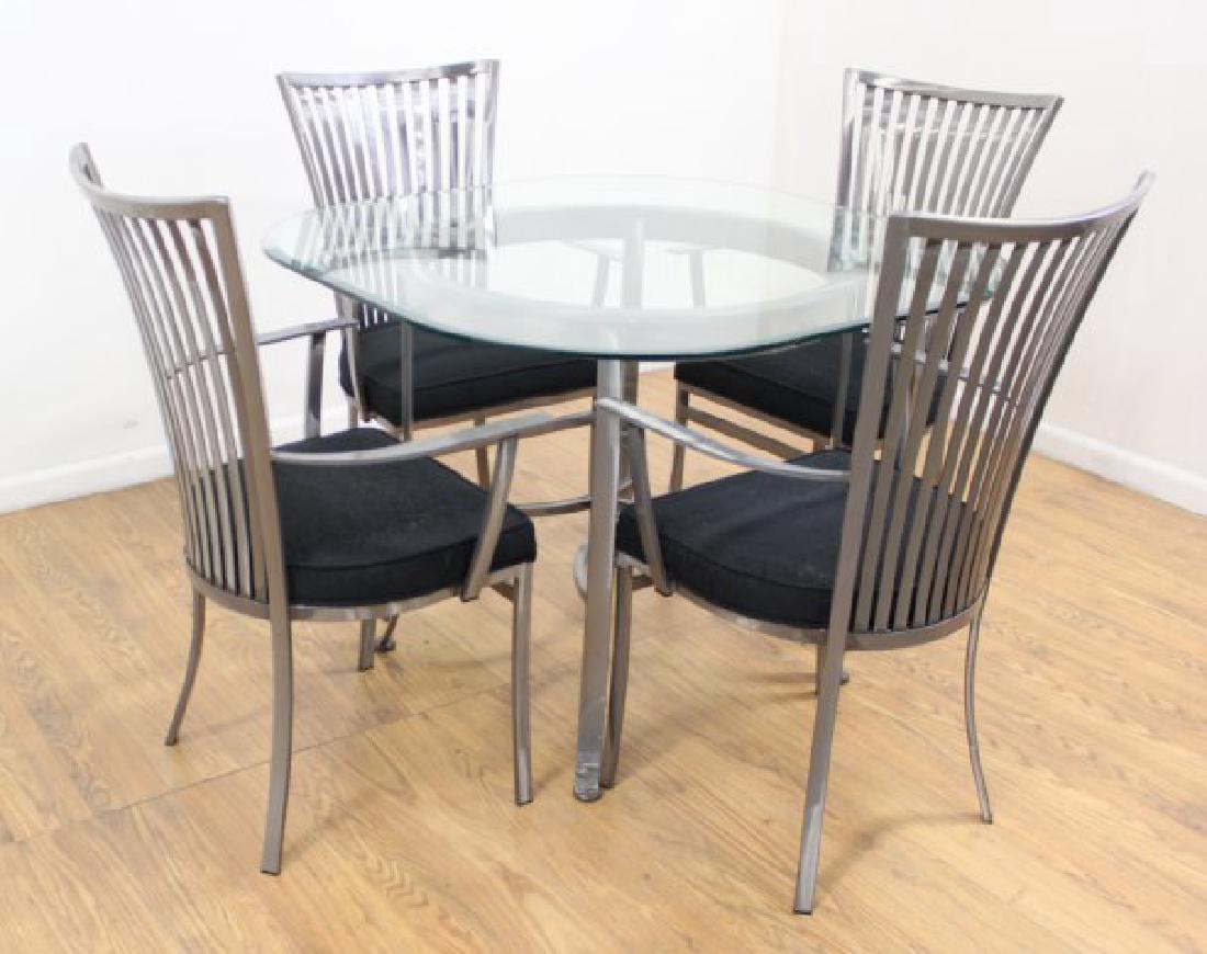 5-Piece Polished Steel Dinette: With bevelled glass top. Table approx. 30" H x 42" square. Chairs approx. 38 1/2" H x 23" arm to arm.