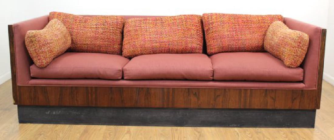 Milo Baughman Rosewood Couch: Circa 1960. Approx. 30" H x 90" W x 35" D. Property from the Erno Laszlo Institute, West Broadway, NYC. (6191) Plinth missing metal veneer. Some veneer chips.