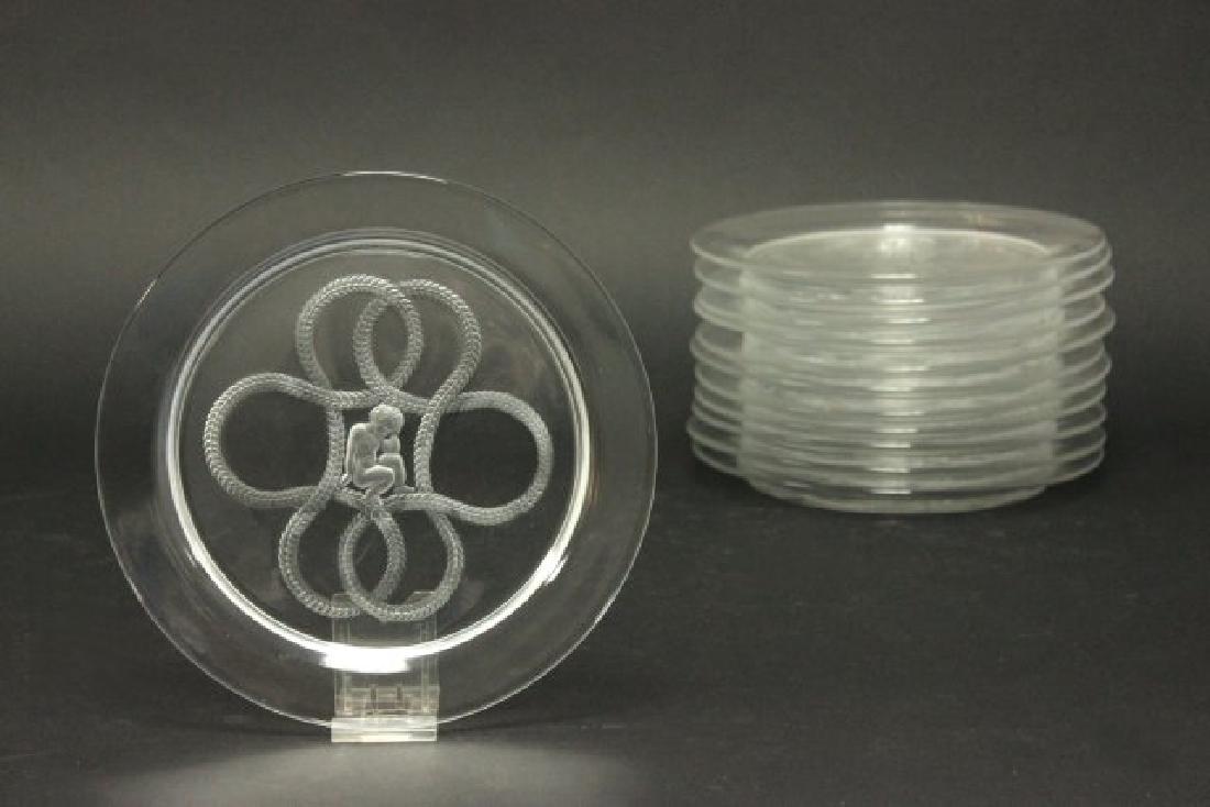 Set of 12 Lalique Olympe Cherub Love Knot Plates: Approx. 8 1/4" diameter. (6087) Very good condition.