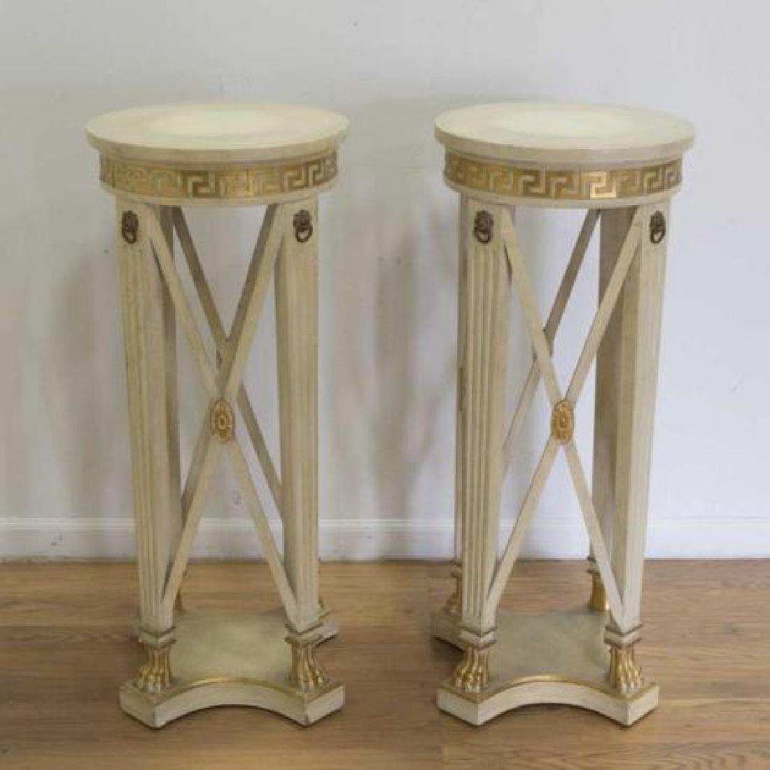 :Pair Regency Style Pedestals: Off-white with gold highlights. Grecian key design. Lion heads with claw feet. Approx. 36 1/2" H x 15 1/4" D. (6113)