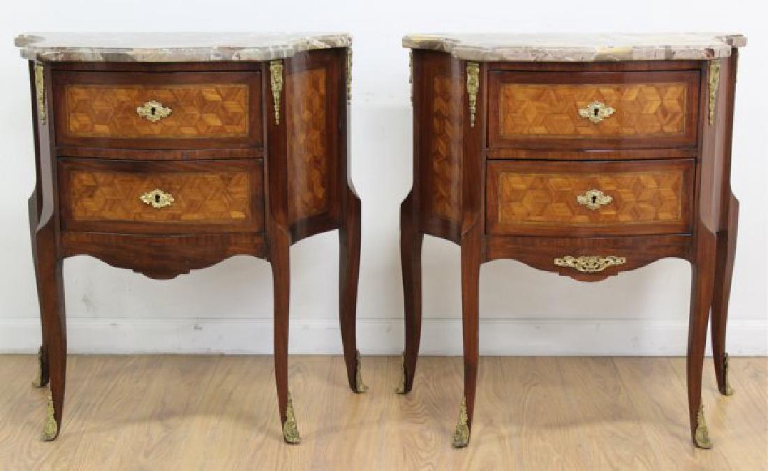 Pair French Inlaid Marble Top 2-Drawer: Bronze mounted. Approx. 29" H x 26" W x 14 1/2" D. From the liquidation of Barnette Shure Antiques in Valley Stream, NY. 1 bronze mount missing under 1 drawer.