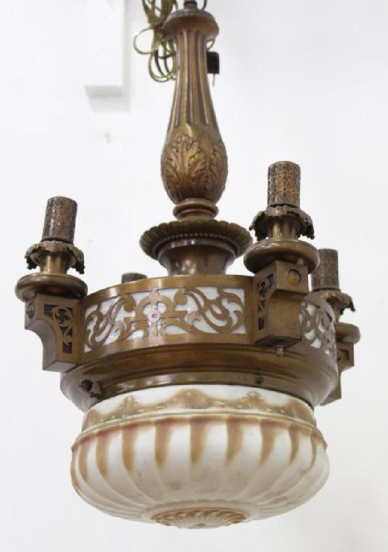 Arts & Crafts 4-Light Brass Chandelier with Dome: Circa 1900. Milk glass with caramel highlights. Slag glass surrounds. Approx. 28" H x 16" D. From the liquidation of Barnette Shure Antiques in Valley Stream, NY.