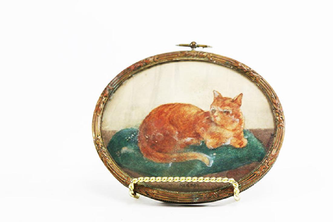 Oval Pastel of a Seated Cat: Mounted in brass frame. Redney. Approx. 4" H x 5" W. (5708)