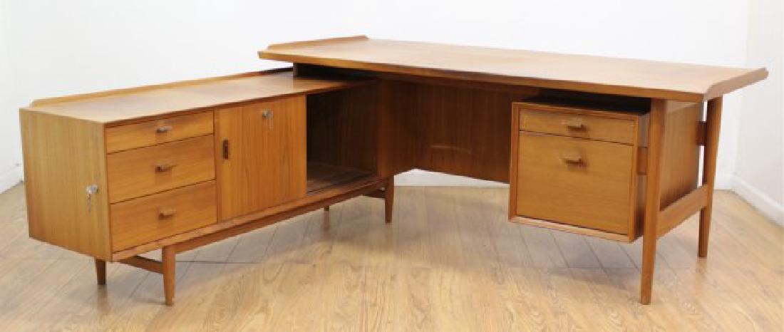 Arne Vodder Teak L-Shaped Desk: Circa 1960. Desk approx. 30 1/2" H x 70 3/4" W x 31 1/2" D. Cabinet approx. 25" H x 65 3/4" W x 16 1/2" D. (6208) Sun bleaching on both.