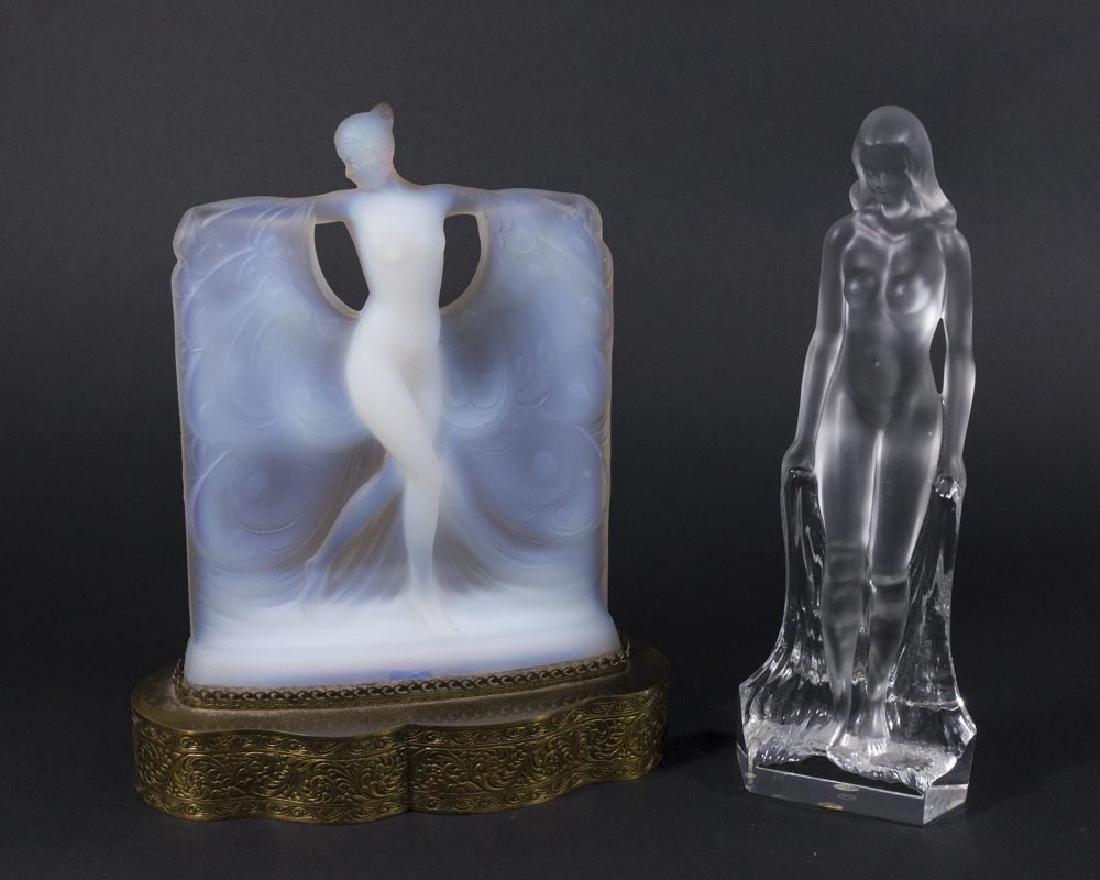 2 Glass Nude Figures: Opalescent glass nude modeled after the Suzanne figure by Lalique, on brass base, approx. 10 1/2" H with base. Sèvres glass nude, approx. 10 3/4" H. Both with chips.