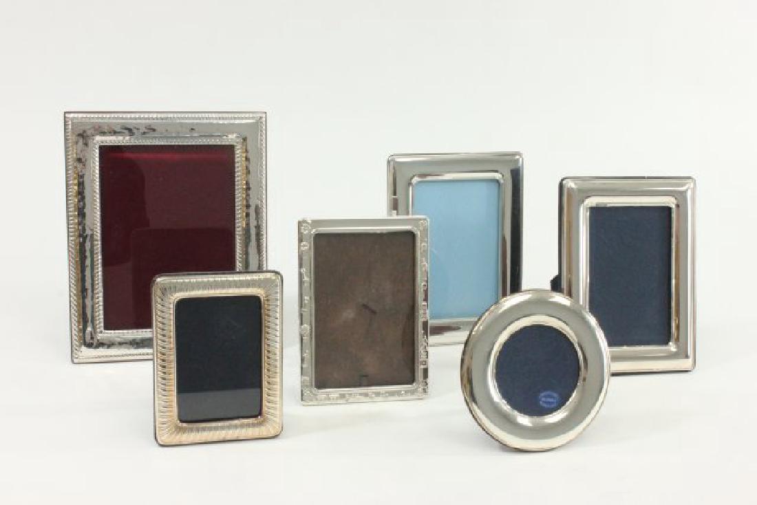 Lot 6-925 Silver Frames: One with a juvenile theme. All stamped. Largest approx. 9 1/2" x 7 1/2".