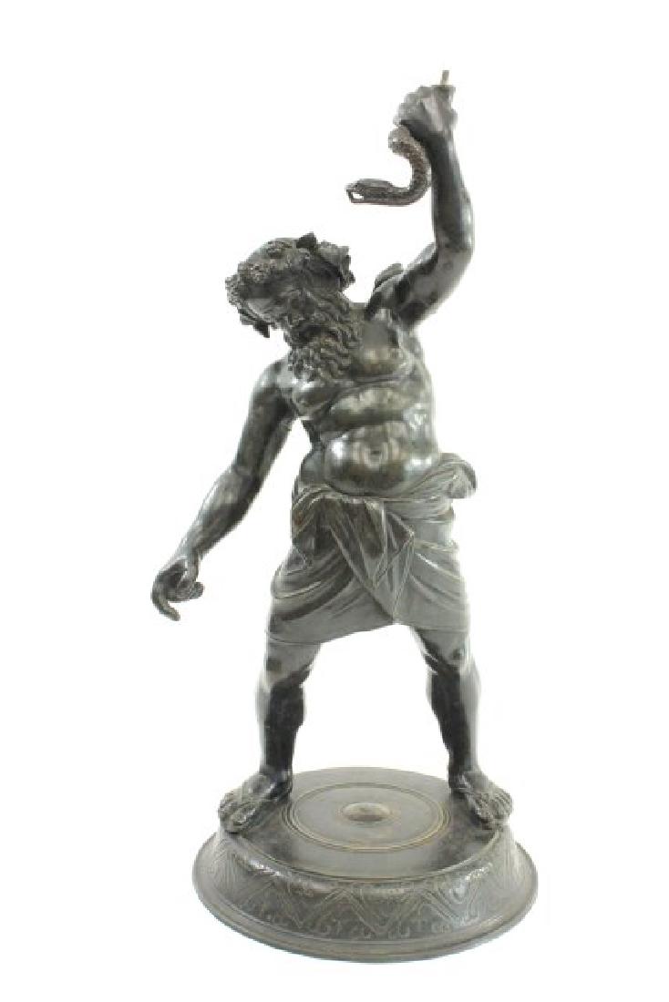 Bacchus and the Snake: Metal sculpture after the antique. Approx. 22" H. Missing part of snake.