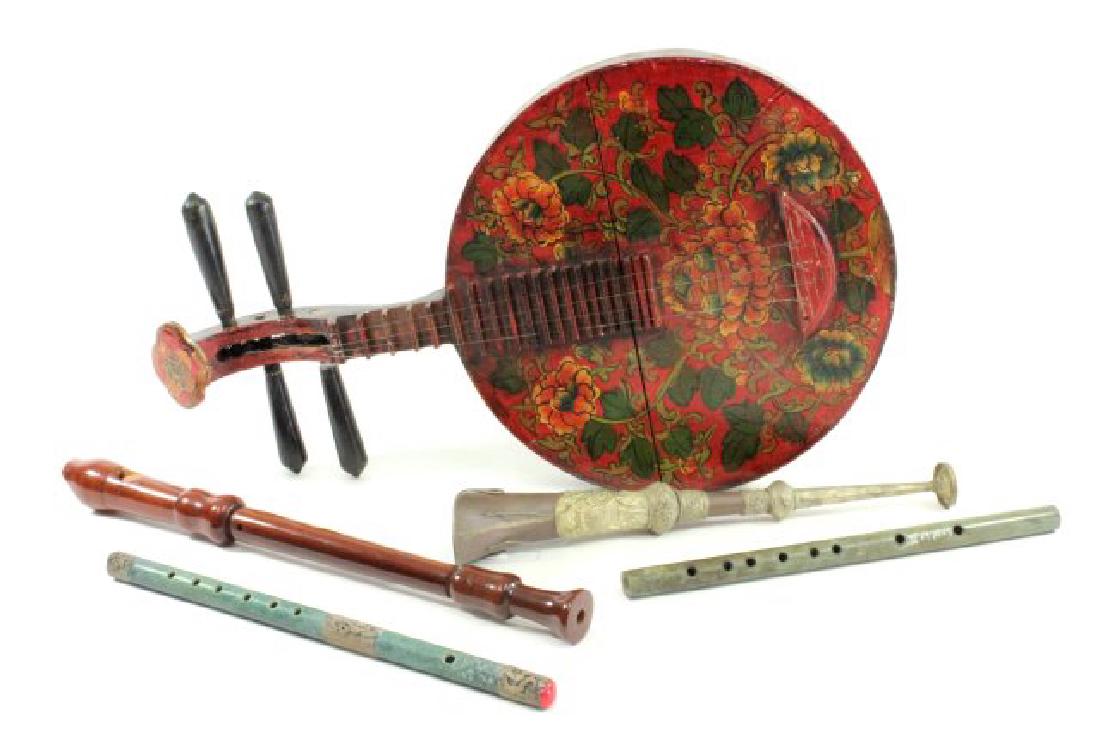 5 Musical Instruments: Including Asian painted stringed instrument, approx. 25" H x 14" W; Asian hardstone flute, approx. 14 1/2"; Asian hardstone flute with metal relief, approx. 15"; copper horn, approx. 16 1/2"; and wood