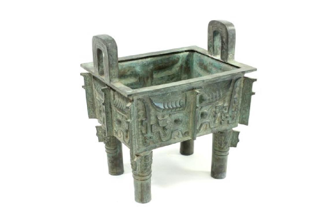 Chinese Iron Planter with Verdigris Patina: Approx. 14" H x 12" W. (6232)