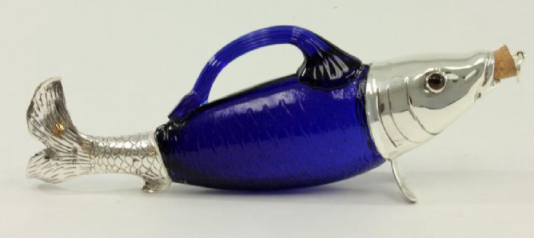 Silverplated Cobalt Glass Fish Decanter: Contemporary. Approx. 4 1/2" H x 13" W.