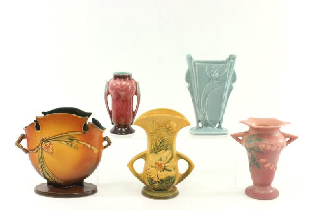 5 Roseville Vases: 4 signed and numbered. Numbers on four, 845 - 8", 965 - 7", 62 - 8", 885 - 8". Flake on handle of smallest.