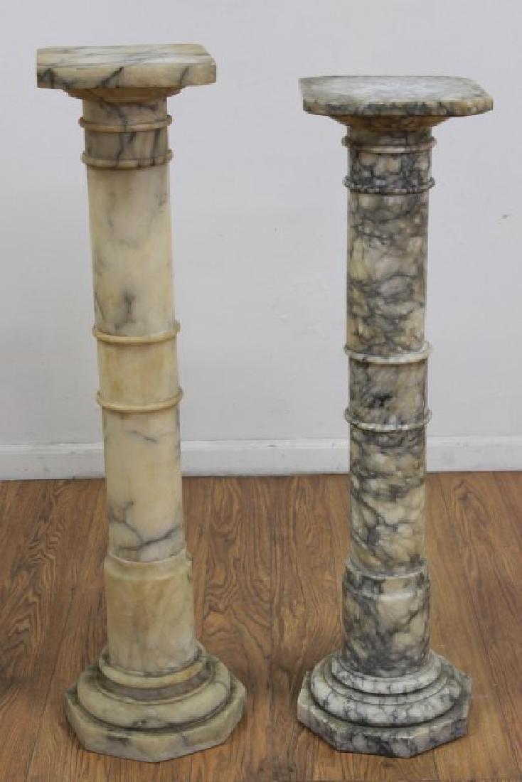 2 Alabaster Pedestals: Approx. 39 1/2" H x 10" D and 40" H x 9 1/2" D.